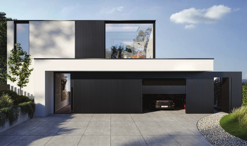 Maison contemporaine noire avec châssis et porte de garage sur mesure